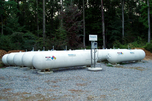 
                    Ten big tanks (1000 gallons each) where Mike Strizki stores hydrogen. It's the same type of tank you might use to store propane.
                                            (Eugene Sonn)
                                        