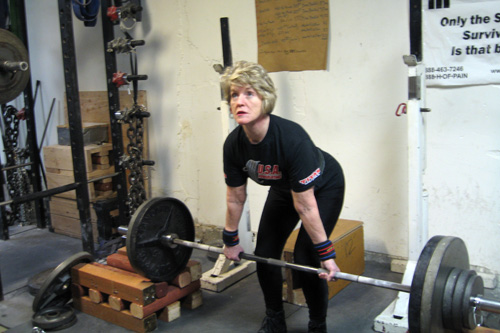 
                    Faith Ireland lifting weights in her Seattle gym.
                                            (Jeannie Yandel)
                                        
