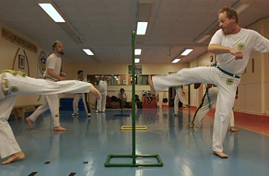 
                    At his last capoeira class before his big trip BJ hones his fighting moves.
                                            (Amanda Kowalski)
                                        