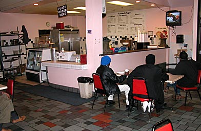 
                    Somali expatriates watch the news in a coffee shop at the mall.
                                            (Ellen Guettler)
                                        