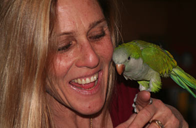 
                    Susan Schaffel plays with her pet bird Maria.
                                            (photog)
                                        