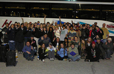 
                    Protesters in Kansas City gather in front of a bus for a group photo before heading to Washington, D.C.
                                            (Kaedden M. Timi)
                                        