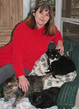 
                    Sheila Smith is the Founder of Shadowcats. She sits at home in a sanctuary she's built for 67 rescued feral cats.
                                            (Michael May)
                                        