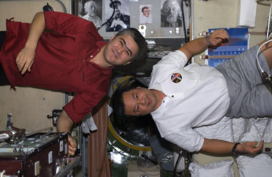 
                    Leroy and Salizhan aboard the International Space Station.
                                            (Leroy Chiao)
                                        