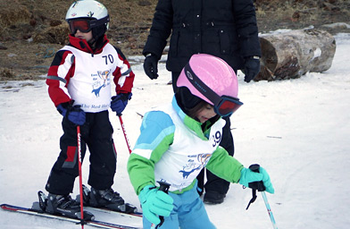 
                    Two mini skiers prepare for the Kinder Kup Ski Race at Heavenly Ski Resort, Lake Tahoe, California.
                                            (Laila McClay)
                                        
