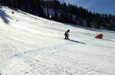 
                    A skier crosses the finish line at this race for kids under 6 years old.
                                            (Laila McClay)
                                        