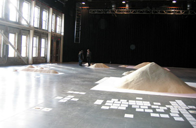 
                    A pyramid of rice represents the world's population.
                                            (Mass. MoCA)
                                        