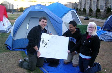 
                    Campers hold up a partially finished sign for the game.
                                            (Lindsay Thomas)
                                        