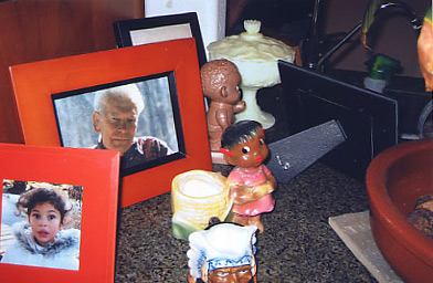 
                    Joe and romana keep many of their figurines among the family pictures.  It makes for an interesting still life.
                                            (Krissy Clark)
                                        