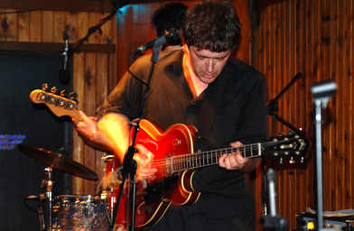 
                    Peter Case on stage at the Saxon Pub in Austin, Texas.
                                            (Rich Dean)
                                        