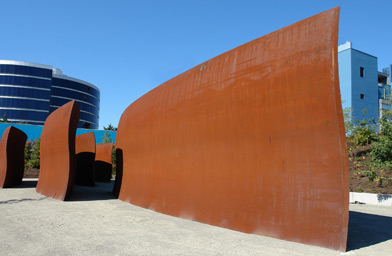 
                    "Wake," 2004. 10 plates, 5 sets of locked toroid forms, weatherproof steel. Richard Serra. Purchased in part with funds from Susan and Jeffrey Brotman, Virginia and Bagley Wright, Ann Wyckoff and the Modern Art Acquisition Fund, in honor of the 75th Anniversary of the Seattle Art Museum, 2004.94 &#169; Richard Serra.
                                            (Paul Macapia)
                                        