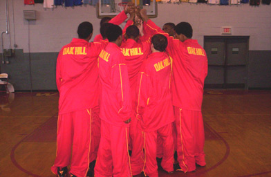 
                    Current Oak Hill players in a huddle.
                                            (Lisa Smith)
                                        