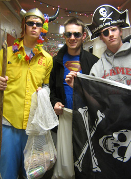 
                    A few freshmen guys brave the halls of a girls' dorm during the few hours they're allowed in there. It's March, but they figure maybe they can get some food out of the deal if they trick-or-treat their way through the rooms.
                                            (Hillary Frank)
                                        