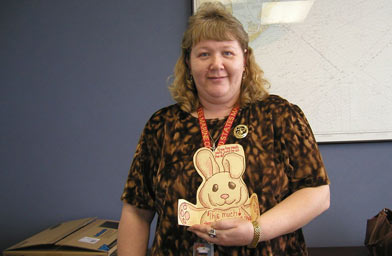 
                    Reba Webster Hollingsworth holding up an Easter card that will go to a member of the military.
                                            (Alex Cohen)
                                        