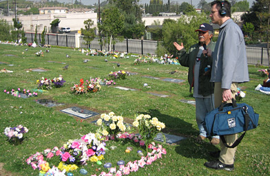 
                    Bill Radke and Tony Vasquez talk, near an Easter-decorated grave.
                                            (Suzie Lechtenberg)
                                        