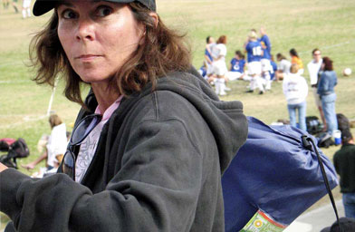 
                    A parent helps out with gear.
                                            (Scott Carrier)
                                        