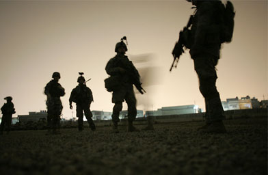 
                    U.S. Army soldiers of the 82nd Airborne Division prepare to raid a house April 20 in Baghdad, Iraq. The same day, Virginia Tech held services to commemorate victims of the April 16 shooting on campus.
                                            (Joe Raedle / Getty Images)
                                        