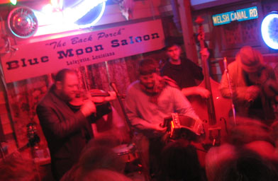 
                    Cajun superstar Steve Riley showed up at the Saloon, briniging his considerable accordion talents to the Red Stick Ramblers' set (left to right Chas Justus, Kevin Wimmer, Glenn Fields, Steve Riley, Eric Frey and Linzay Young).
                                            (Ian McNulty)
                                        