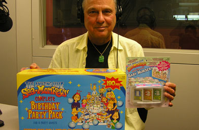 
                    George C. Atamian, president and COO of the Amazing Live Sea Monkeys division of Educational Insights, pays a visit to Weekend America's studios, accompanied by many of his closest friends.
                                            (Millie Jefferson)
                                        