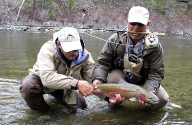 
                    Jeff Metcalf (left) and Steve Cole with a steelhead on the Salmon River in Idaho.
                                            (Scott Carrier)
                                        