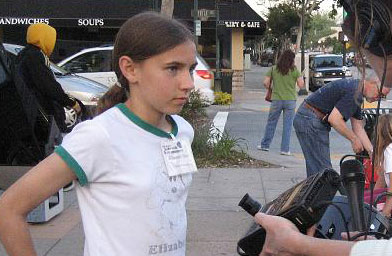 
                    Elizabeth got hooked when she was four and her dad showed her saturn through a telescope.  Now, she and her sister take their telescope out on the street to show others.
                                            (Jane Houston Jones)
                                        