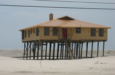 
                    This beach house is still slanted from Hurricane Katrina.
                                            (Eve Troeh)
                                        