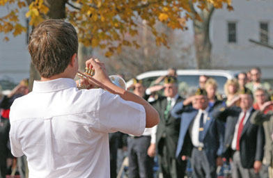
                    Michael McCann plays "Taps" at last November's Veteran's Day ceremony on the Town Common in Hopkinton, Mass.
                                            (HopNews.com)
                                        