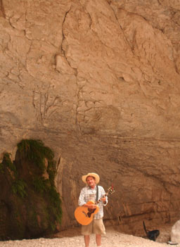 
                    Butch Hancock sings and plays guitar inside Fern Canyon, a small canyon on the Mexican side of the river.
                                            (Michael May)
                                        