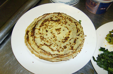 
                    Handmade crepes are part of the dessert. They'll have peaches, yogurt, and fruit puree added.
                                            (John Moe)
                                        