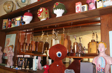 
                    Artist Nikol Lohr, owner of Harveyville High, collects anatomical models. She's put them on display along with trophies from the school's past sporting glories.
                                            (Frank Morris)
                                        