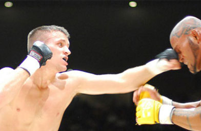 
                    Ultimate Fighting Championship Veteran Jason Dent has won 12 fights and lost 8. Here, Dent's jab connects at Super Brawl in September 2006. Dent won the fight.
                                            (GriffonRawl Academy)
                                        