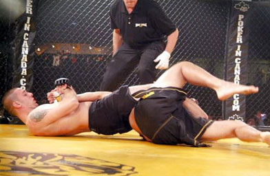 
                    GriffonRawl Academy fighter Donny Walker executes an "Arm Bar" submission hold at King of the Cage in Edmonton, Canada.
                                            (GriffonRawl Academy)
                                        