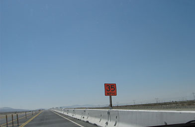 
                    Drivers are warned to slow down near a road work site along Pearblossom Highway in Southern California. Not all of them do.
                                            (Eve Troeh)
                                        