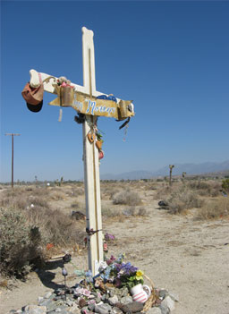 
                    Homemade crosses mark the place that a family died along the route.
                                            (Eve Troeh)
                                        