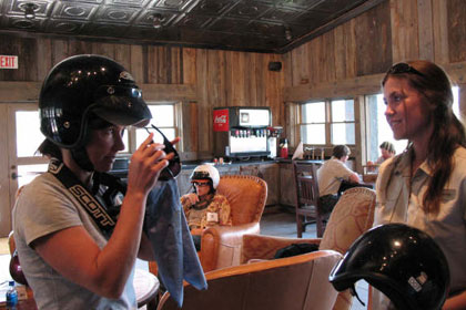 
                    A Cowgirl U. participant suits up for the wearing of the dirt mustache, an added bonus of riding ATVs on a dusty Montana trail.
                                            (Jule Gardner)
                                        