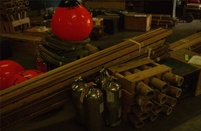 
                    Everything the small town of Lake Tapps, Wash needs for its 4th of July show: floating buoys racks for the launching equipment, lots of cable, and an assembly of fire extinguishers.
                                            (John Moe)
                                        