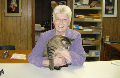 
                    Judy Julian of EFI makes sure the cats stay out of danger during firework testing.
                                            (John Moe)
                                        