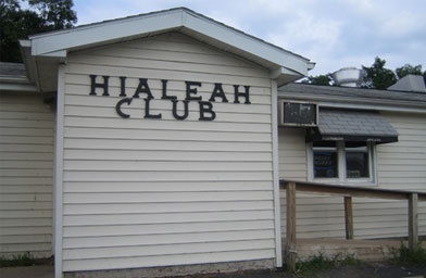 
                    The Hialeah Club is one of two bars in All American Attractions. Bars are the only business in town.
                                            (Reprinted with permission from Reaching Climax: And Other Towns Along the American Highway. Copyright 2006 by Gary Gladstone, Ten Speed Press, Berkeley, CA. Gary Gladstone.)
                                        