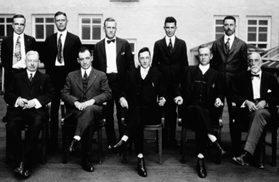 
                    The men seen here exude the confidence and seriousness felt by businessmen of the day, circa 1925.
                                            (Harry Ransom Center)
                                        