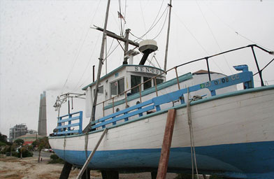 
                    A boat rests off-shore.
                                            (Kristi Highum)
                                        