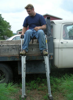 
                    Richard Nattrass puts on his stilts.
                                            (Martin Wells)
                                        