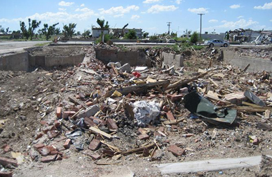 
                    Greensburg businesses sit in a pile of rubble.
                                            (Jon Cyphers)
                                        