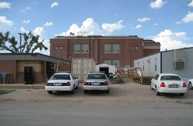 
                    The Greensburg Police Station and Courthouse is one of few buildings that somehow survived.
                                            (Jon Cyphers)
                                        