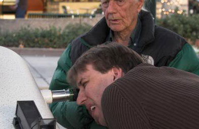 
                    Dobson says he's hard to impress at star parties these days.  He's already seen it all through his telescope.  But he likes showing others, and explaining what they're seeing.
                                            (Jane Houston Jones)
                                        