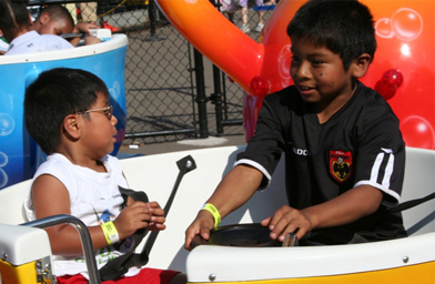 
                    Carter McDonald and Diego Luke take a whirl in the teacups.
                                            (Dan Luke)
                                        