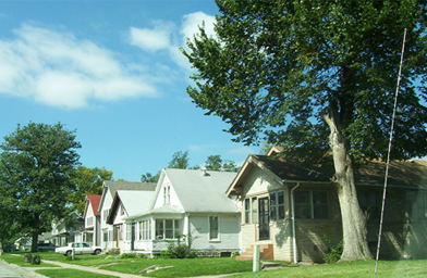 
                    Omaha may have the highest child poverty level in America (60 percent), the third highest black poverty level (40 percent) and the fifth smallest black middle class, but plenty of people are able to get by.  This is a street in North Omaha not far from 24th Street.
                                            (Lawrence Lanahan)
                                        