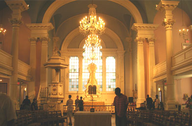 
                    The altar of St. Paul's Chapel in New York City has been moved to the center with chairs facing inward to form a circle.  This is where Sunday services are held.
                                            (Ann Heppermann)
                                        