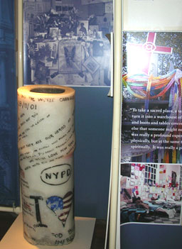 
                    A candle was placed at a 9/11 memorial altar and historical display at the church.
                                            (Ann Heppermann)
                                        