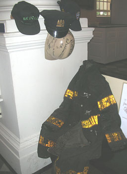 
                    The pews in St. Paul's Church were removed this April and replaced with chairs facing the altar.  A pew remains in the back as part of a display describing how firefighters and other volunteers used the pews as a place of rest.
                                            (Ann Heppermann)
                                        