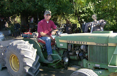 
                    John Thompson of Thompson Farms in Naches, Wash., on his tractor.
                                            (John Moe)
                                        